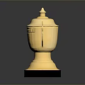 Ornamental Golden Trophy With Lid Handles Engraved Details And Black Base
