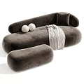 Beige And Green Tiger Patterned Irregular Shaped Sofa With Round Cushions And Plaid Blanket