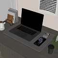 Black MacBook Laptop on Wooden Desk with Smartphone AirPods and Office Supplies