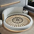 Round Bed With White Headboard Brown Beige Pillows Gray Brown Blanket Modern Bedroom