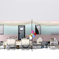 Public Facility Outdoor Rest Area with Canopy Tables Chairs and Colorful Balloons