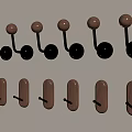 Decorative Wall Hooks with Metal Balls and Wooden Rectangular Shapes Mounted on Light Colored Wall
