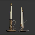Lit White Candles On Decorative Metal Candle Holders With Intricate Patterns
