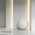 Circular Marble Sphere Component On White Marble Walls With Lighting Accents