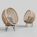 Stylish Rattan Leisure Chairs With Round Design And Gray Cushions On Metal Legs
