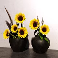 Black Vases with Sunflowers and Dried Grass on Gray Countertop White Wall