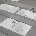 White Washbasins with Silver Faucets on Grey Countertops Modern Design