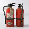 Two Old Red Fire Extinguishers With Black Nozzles And Metal Straps