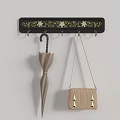 Black Wall Hook Rack With Gold Floral Patterns Hanging Umbrella And Handbag