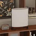 Modern Striped Table Lamp With Black Metal Base On Wooden Shelf And Decorative Elements
