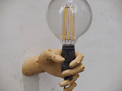 Hand Shaped Wooden Wall Lamp With Transparent Glass Bulb And Filament On White Wall 3d model