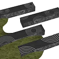 Modern Black Landscape Seats With White Concentric Circle Patterns On Green Grass 3d model