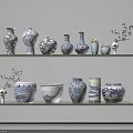 Blue and White Patterned Ceramic Vessels on Wooden Shelves with Dried Branches and Skull Decor
