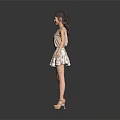 Woman In Sleeveless Top And Patterned Skirt With Arms Outstretched On Gray Background