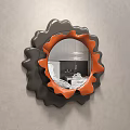 Stylish Mirror With Black And Orange Wavy Frame Mounted On Gray Wall Reflecting Sofa Pillows