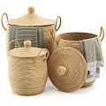 Woven Storage Baskets With Lids Handles And Gray Towels For Home Organization