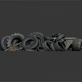 Pile of Old Used Tires Stacked on Metal Pallet with Various Sizes and Worn Surfaces
