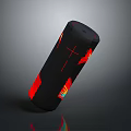 Sleek Black Red Cylindrical Portable Speaker With Modern Design And Compact Size