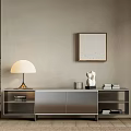 Modern Sleek TV Stand with Table Lamp Sculpture Books and Wall Art on Neutral Wall