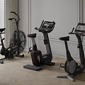 Modern Indoor Fitness Equipment Featuring Air Bike And Stationary Bikes With Digital Screens