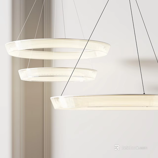 Three Modern White Circular Pendant Lights Hanging In Interior Design 3d model