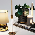 Elegant Table Lamp With Gold Base Cream Lampshade And Green Leaves Plant Candles On Books