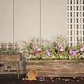 Plant Combination with Pink Flowers Green Foliage in Wooden Planters Against Beige Wall White Lattice