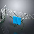 White Clothes Drying Rack with Green Stand Hanging Blue Towel for Drying