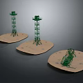 Three Green Tower Shaped Furniture Pieces With Beige Circular Bases For Modern Home Decor