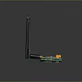 Electronic Green Circuit Board Module With Orange Square Component Blue Chip Long Black Antenna