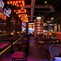 Industrial Bar Interior Design With Brick Walls Pendant Lights And Neon Signs