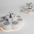 Modern Public Chairs Featuring Circular Seats Illuminated Edges Stack Of Books And Small Plant