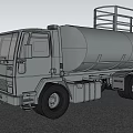 Silver Tanker Truck with Metal Rails on Sandy Ground Under Blue Sky