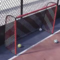 Outdoor Fenced Soccer Field With Artificial Turf Red Areas Center Mark Lighting And Benches