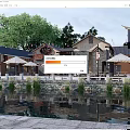 Charming Traditional Chinese Commercial Street With Outdoor Seating Umbrellas Waterfront Trees