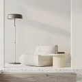 Minimalist White Bean Bag Chair with Floor Lamp Side Table and Book in Modern Room