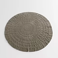 Neutral Toned Round Rug with Textured Ruffled Edges and Concentric Patterns