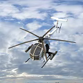 Fighter Jets And Military Helicopters Flying In Blue Sky Formation
