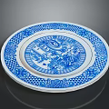 Intricate Sculptural Carving On Ceramic Plate With Blue White Pattern And Ornate Design