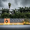 Modern Garden Feature Wall With Stone Panels Circular Decor Lighting And Palm Tree Greenery