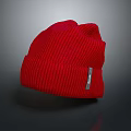 Red Soft Ribbed Knit Beanie With Tag On Gray Background