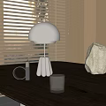 Modern Table Lamp with Dome Shade on Wooden Table and Decorative Items Near Window Blinds
