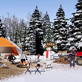 Snowy Winter Camping Site With Orange Tent Bonfire Snowman Pine Trees And Red Truck