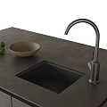 Sleek Modern Washbasin Setup With Dark Countertop Faucet Bowl And Fresh Limes