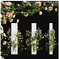 Floral Decoration Design With White Pillars Wrapped Flowers And Hanging Greenery