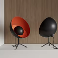 Modern Egg Shaped Table Lamps Orange Black and Black with Tripod Base on Wooden Wall