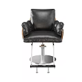 Black Leather Massage Chair With Comfortable Armrests And Metal Base Footrest