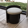 Modern Round Stool With Black Frame Light Gray Cushion On Wooden Floor By Window