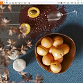 Fresh Ripe Apricots in Wooden Bowl on Blue Table with Wine Glass and Dried Plants