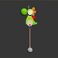 Green Cartoon Character Rattle Toy With Colorful Details Long Stick And White Ball Base
